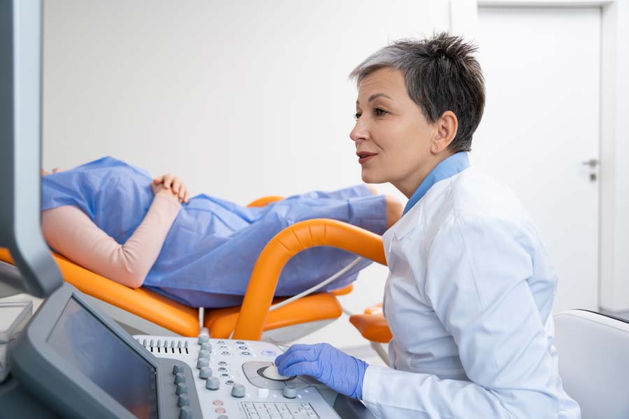 Female Doctor reviewing ultrasound